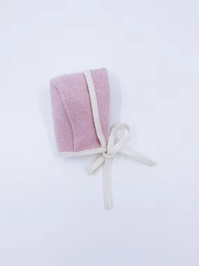 Beautiful pink merino wool bonnet with cream details.
