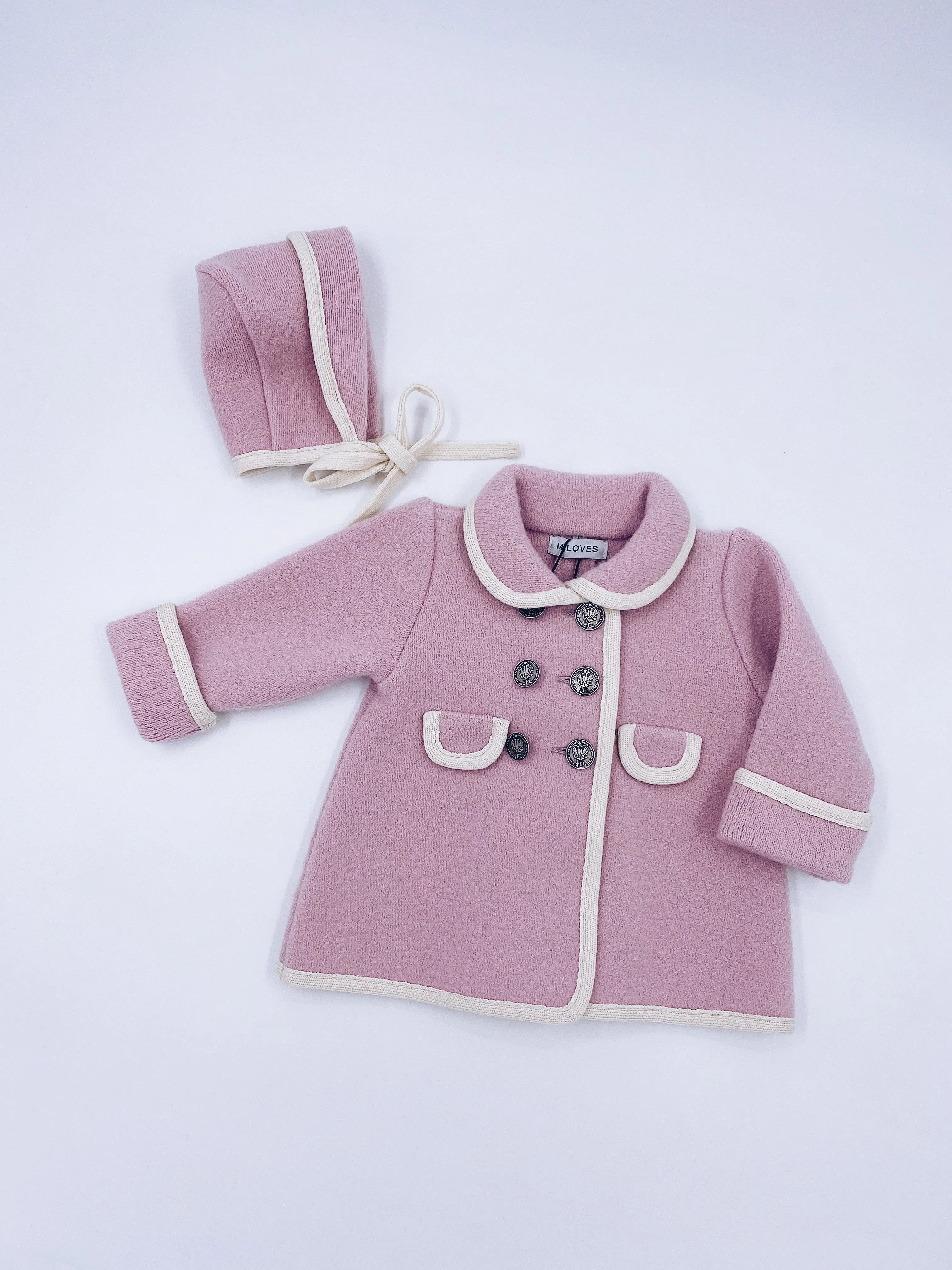 Beautiful pink merino wool bonnet with cream details.