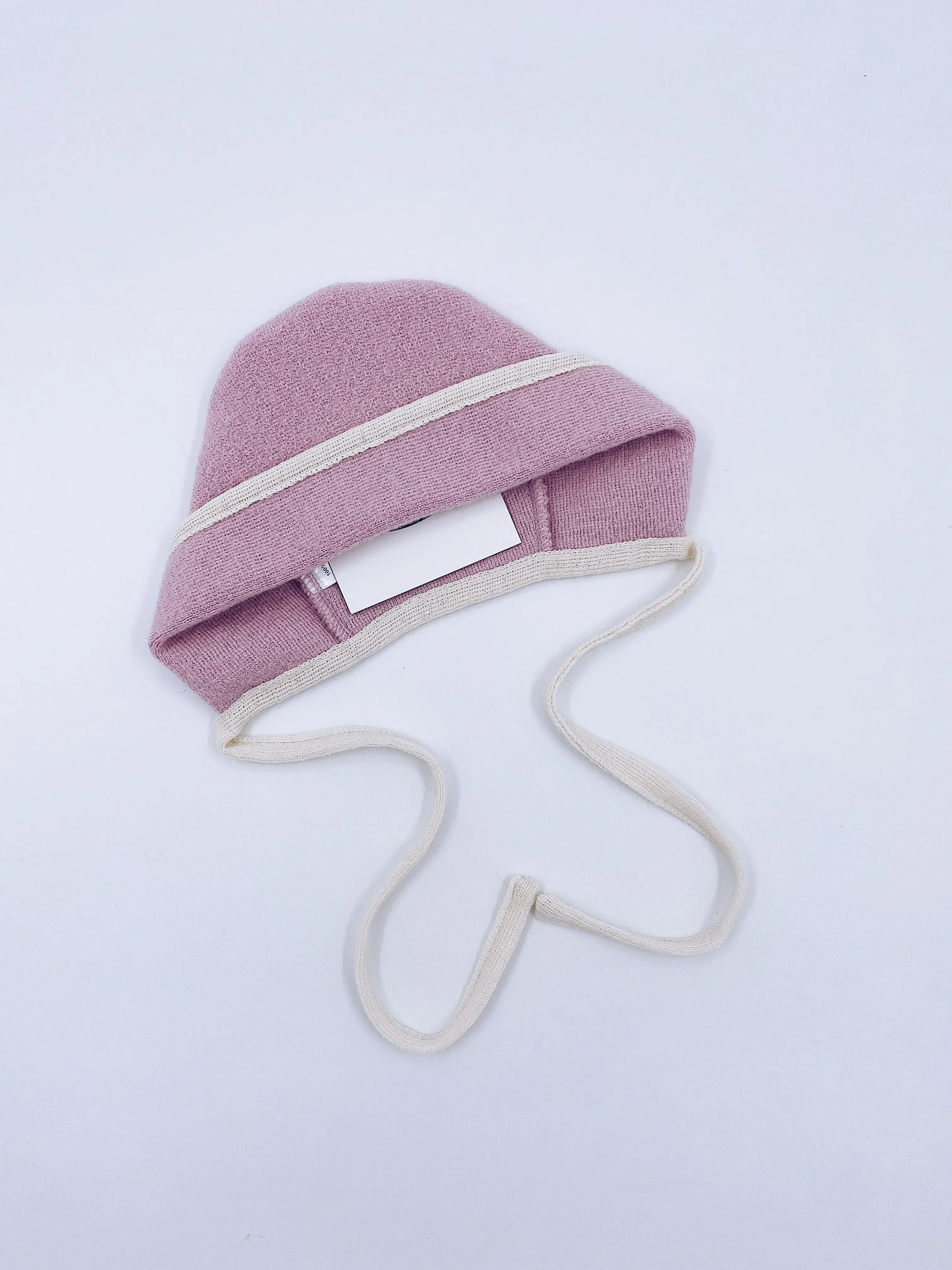 Beautiful pink merino wool bonnet with cream details.